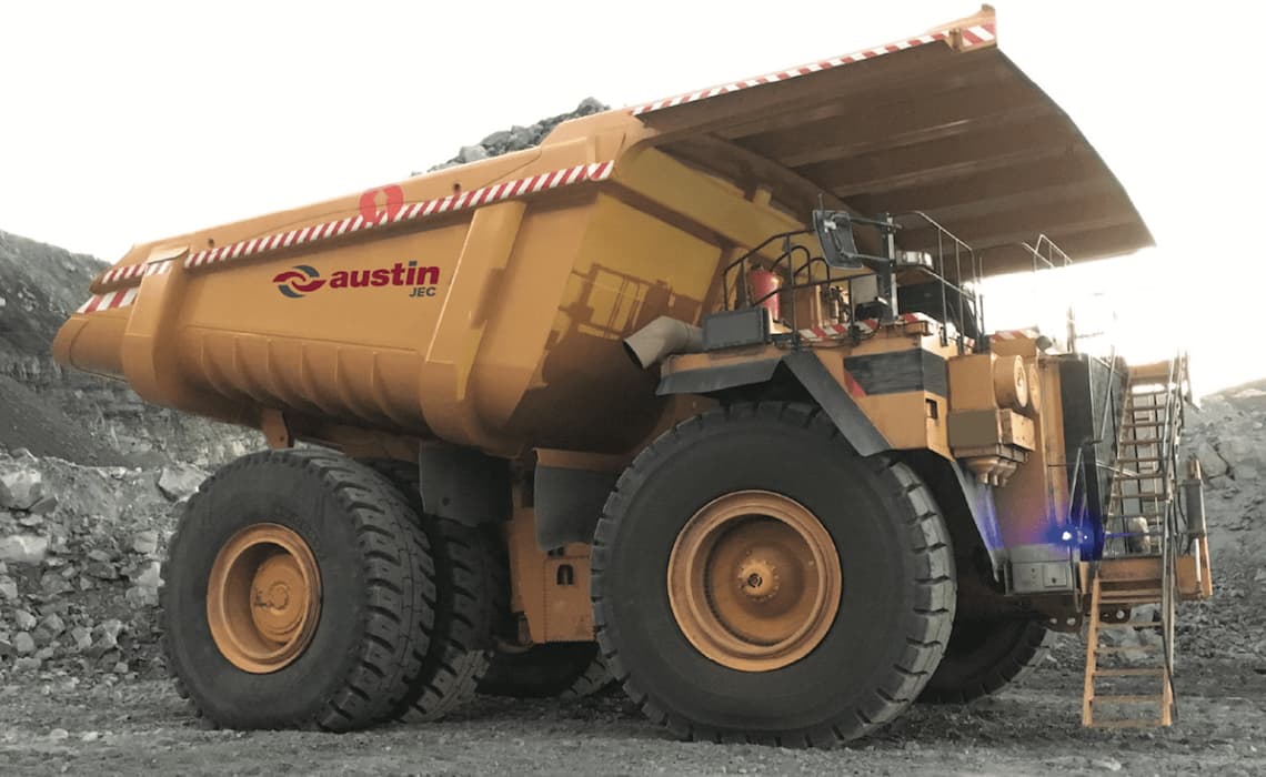 Surface mining tyre handlers attached to a mining water tank